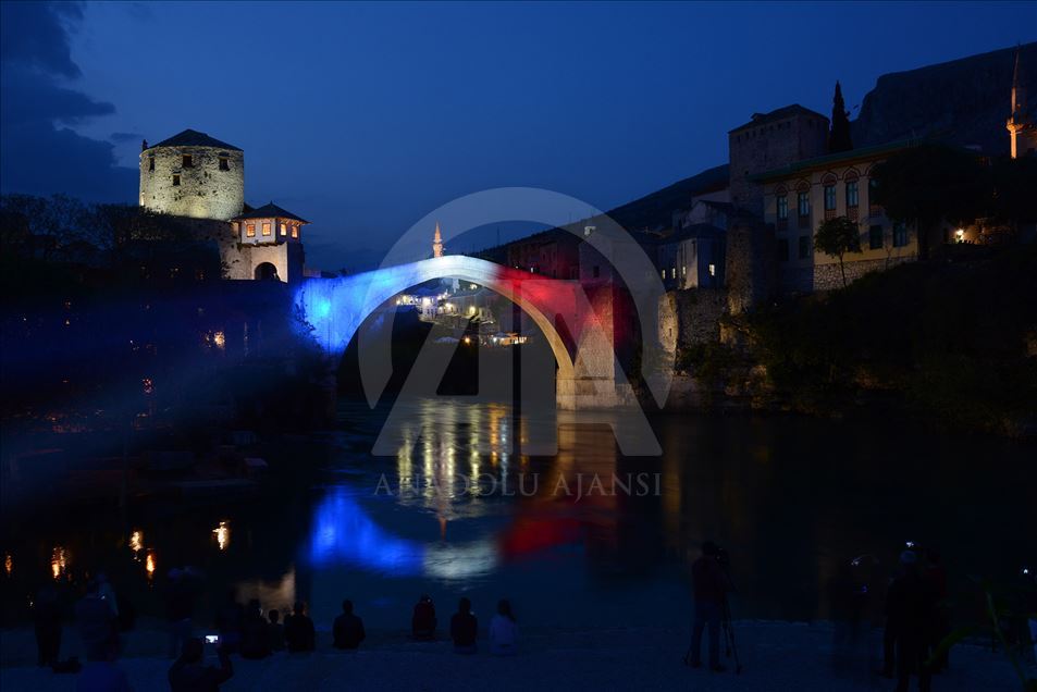 Mostar Bridge is illuminated for the Notre-Dame Cathedral