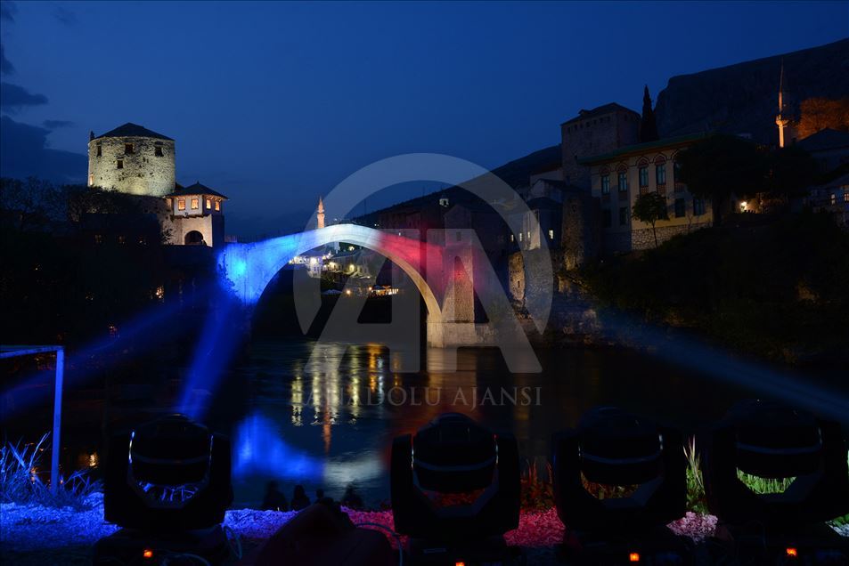 Mostar Bridge is illuminated for the Notre-Dame Cathedral