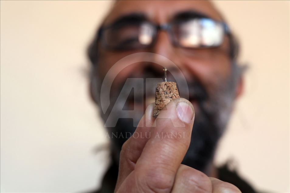 نووسینی سورهتی (الاخلاص) لهسهر تۆوی ههنجیر