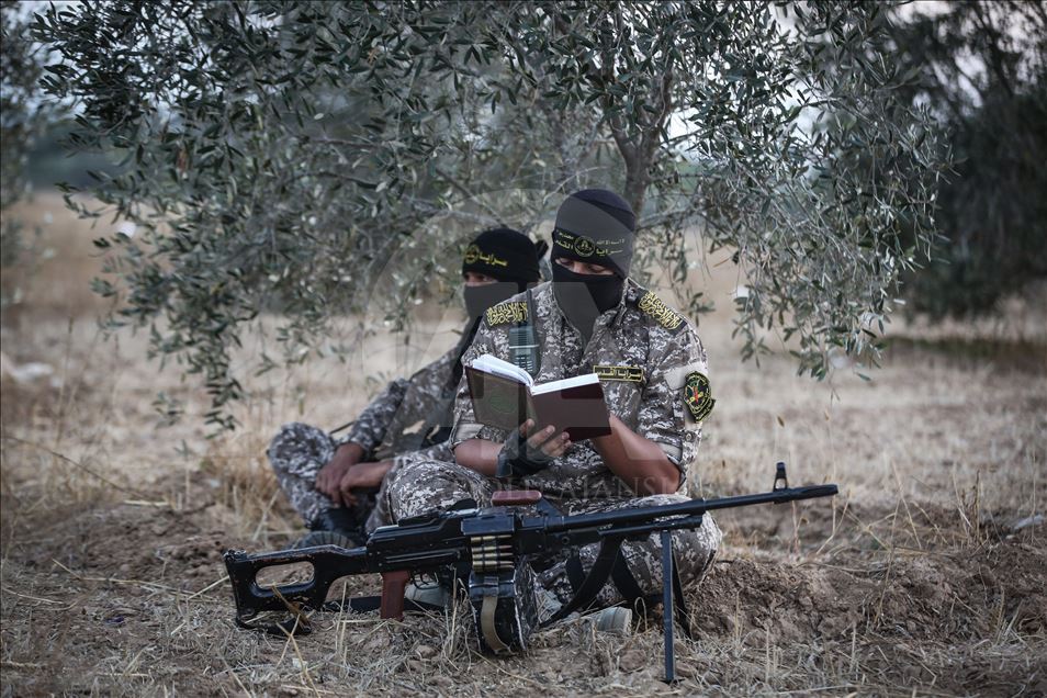 Members of Saraya al-Quds keep guard at Israeli border 