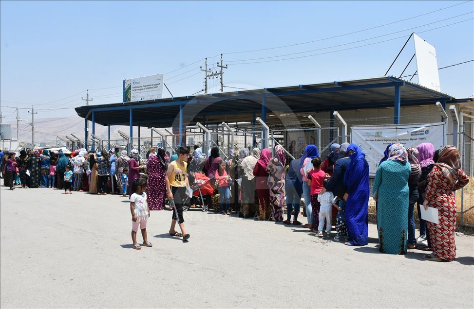 Türk Kızılayı tarafından Irak'taki Suriyeli sığınmacı ailelere giyim yardımı