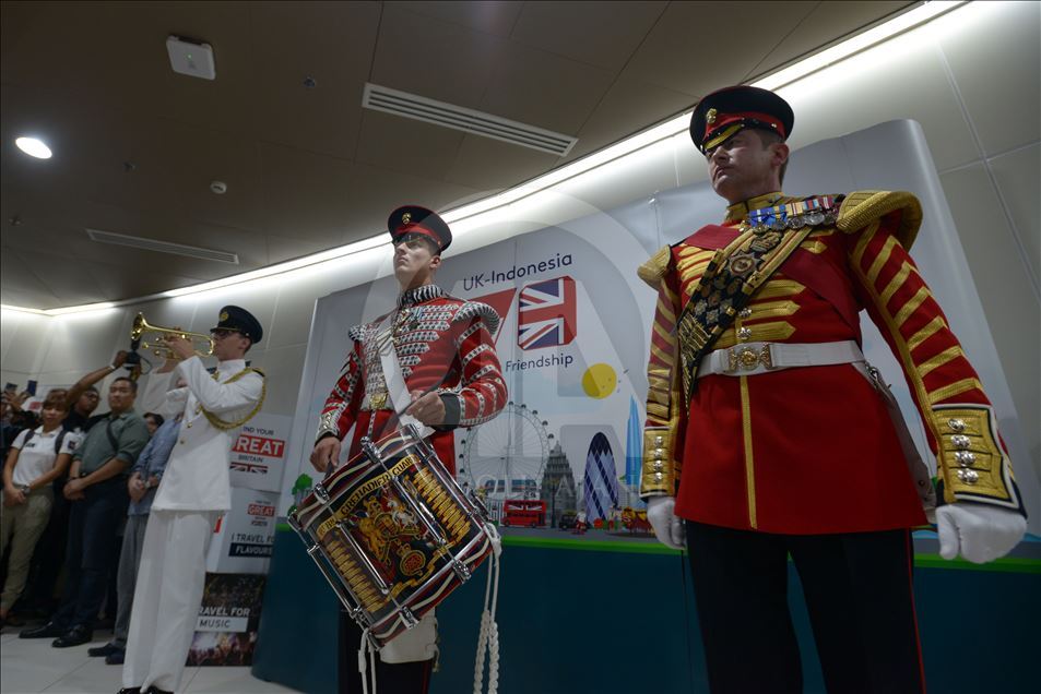 British military musicians play music at the Jakarta MRT station
