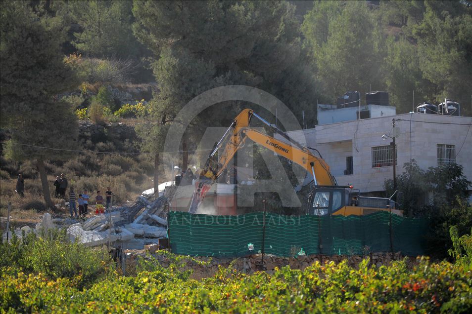 Israeli forces demolish a house of a Palestinian
