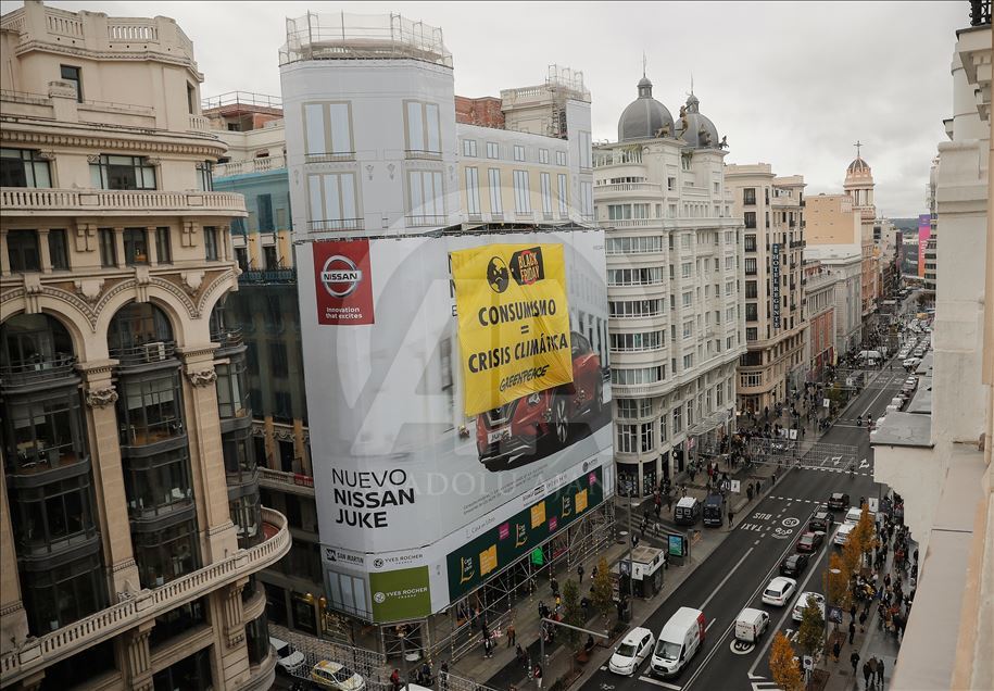 Greenpeace activists protest in Madrid on Black Friday