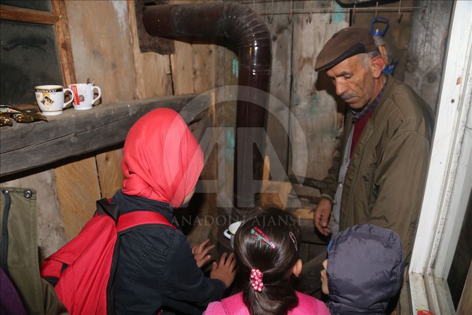 A local man heats the shack for students every morning in Turkey