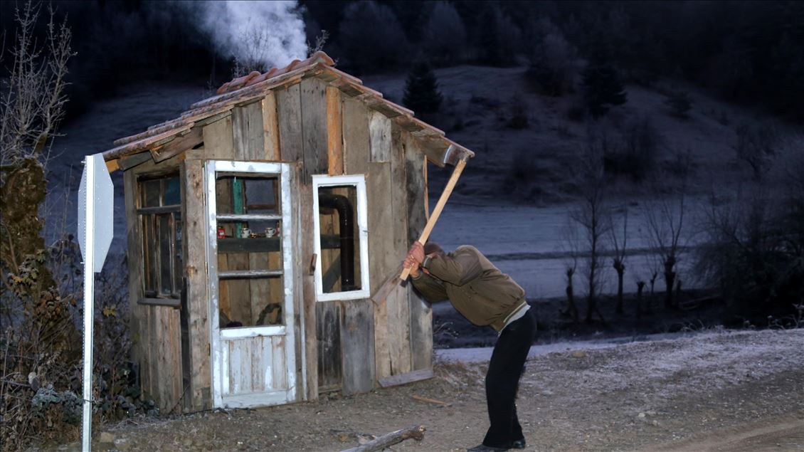 A local man heats the shack for students every morning in Turkey