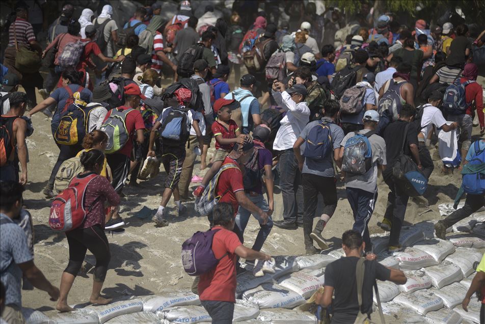 Migrants wait at Guatemala - Mexico border
