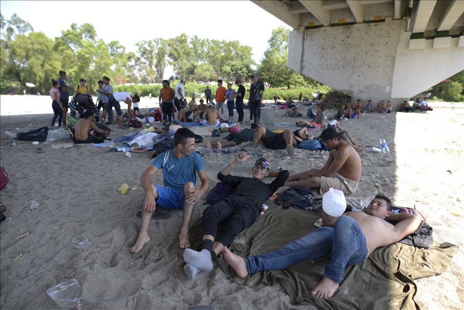 Migrants wait at Guatemala - Mexico border