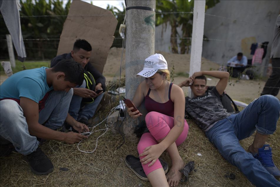 Migrants wait at Guatemala - Mexico border