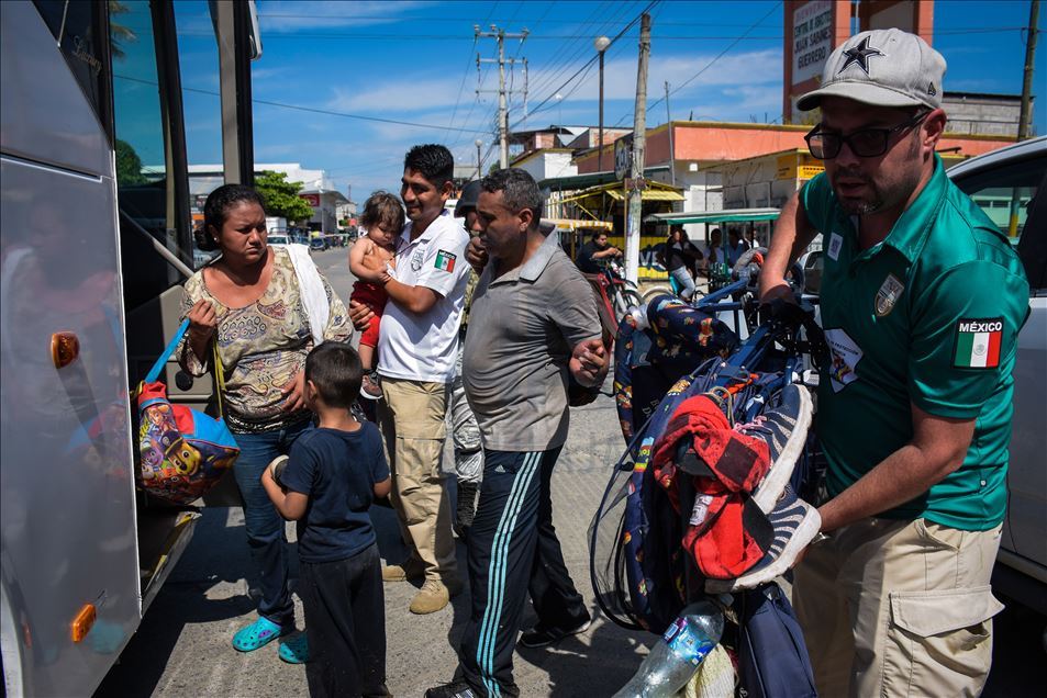Migrants try to cross the border between Mexico and Guatemala