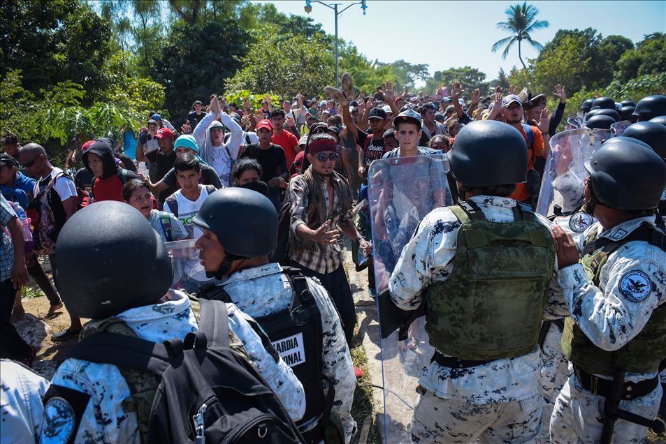 Migrants try to cross the border between Mexico and Guatemala