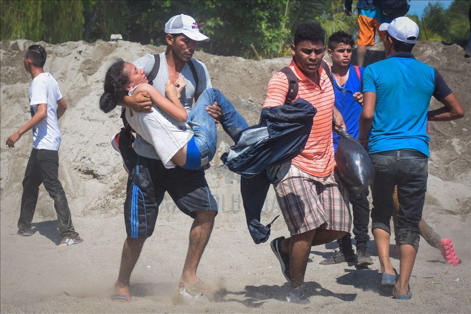 Migrants try to cross the border between Mexico and Guatemala
