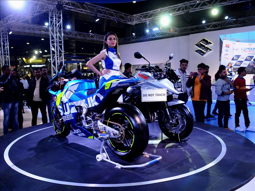 UTTAR PRADESH, INDIA -  FEBRUARY 07 : A model poses next to Suzuki Katana motorcycle at the Auto Expo 2020 , on February 7, 2020, in Greater Noida, India. : Imtiyaz khan