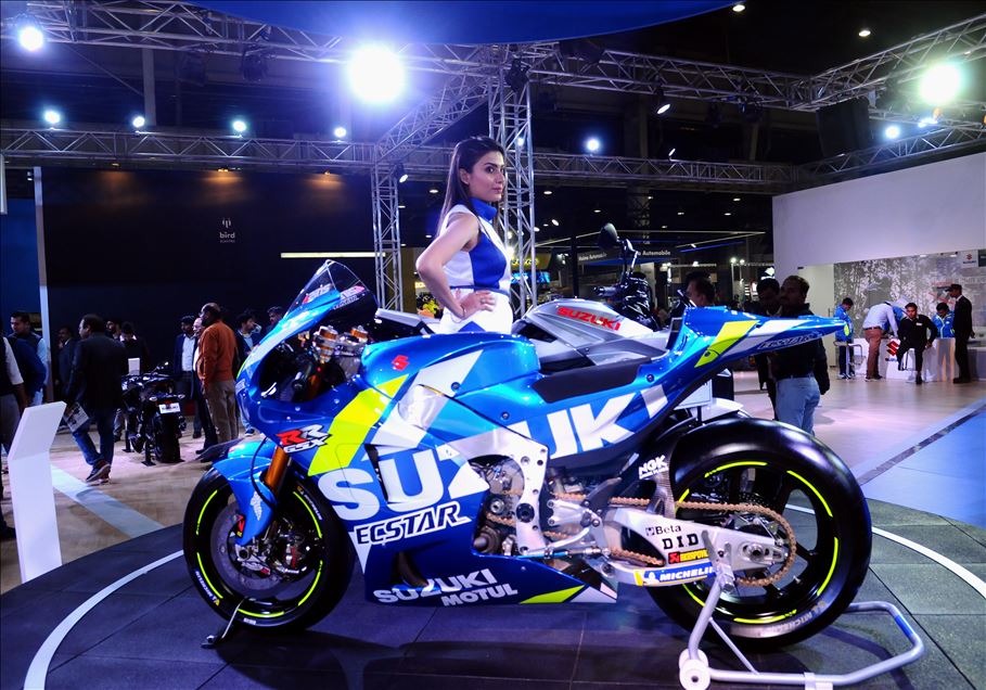 UTTAR PRADESH, INDIA -  FEBRUARY 07 : A model poses next to Suzuki Katana motorcycle at the Auto Expo 2020 , on February 7, 2020, in Greater Noida, India. : Imtiyaz khan