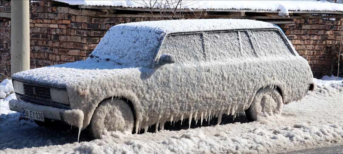 Cold weather leaves cars covered in ice