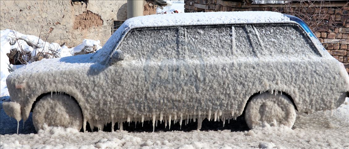 Cold weather leaves cars covered in ice