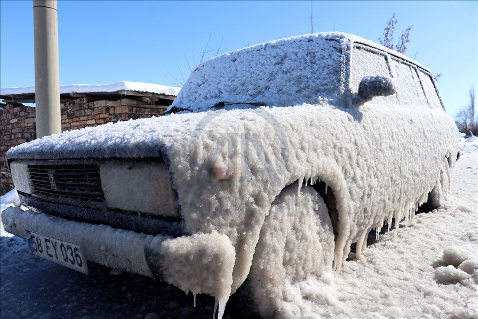 Cold weather leaves cars covered in ice