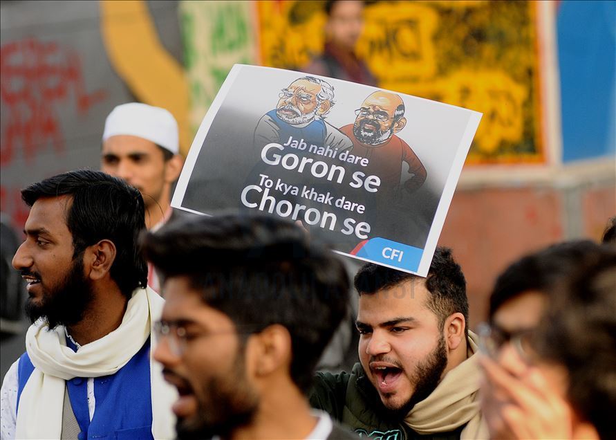 NEW DELHI, INDIA - FEBRUARY 10 : Jamia Students and local residents hold placards and raise slogans during a protest against the Citizenship AmendmentAct (CAA) and National Register of Citizens (NRC), at Jamia Millia Islamia University in New Delhi, Ind