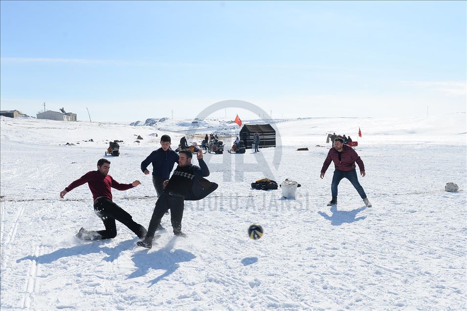 Playing soccer on ice-covered Lake Cildir