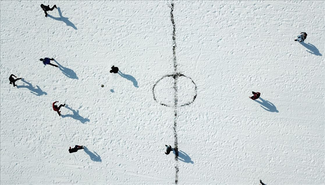 Playing soccer on ice-covered Lake Cildir