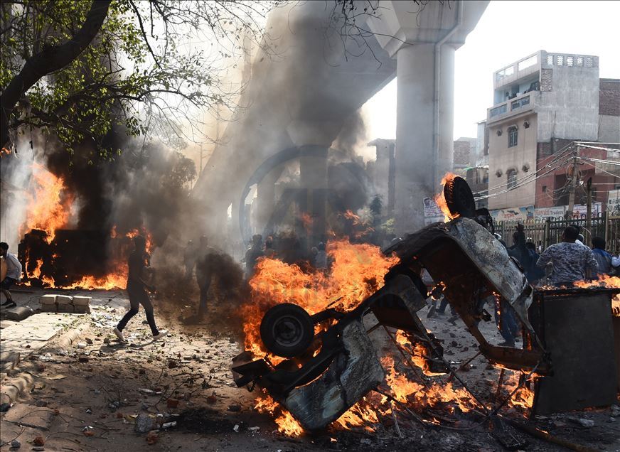 NEW DELHI, INDIA -  FEBRUARY 24 : Vehicles set ablaze as protestors throw brick-bats during clashes between a group of anti-CAA protestors and supporters of the new citizenship act, at Jafrabad in Delhi, Monday February 24, 2020. : Imtiyaz khan