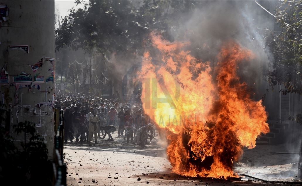 NEW DELHI, INDIA -  FEBRUARY 24 : Vehicles set ablaze as protestors throw brick-bats during clashes between a group of anti-CAA protestors and supporters of the new citizenship act, at Jafrabad in Delhi, Monday February 24, 2020. : Imtiyaz khan