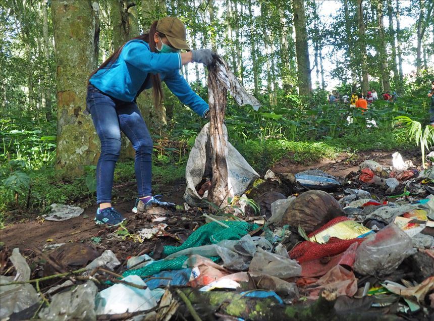 Environmental activists collect wastes in Bali forest

