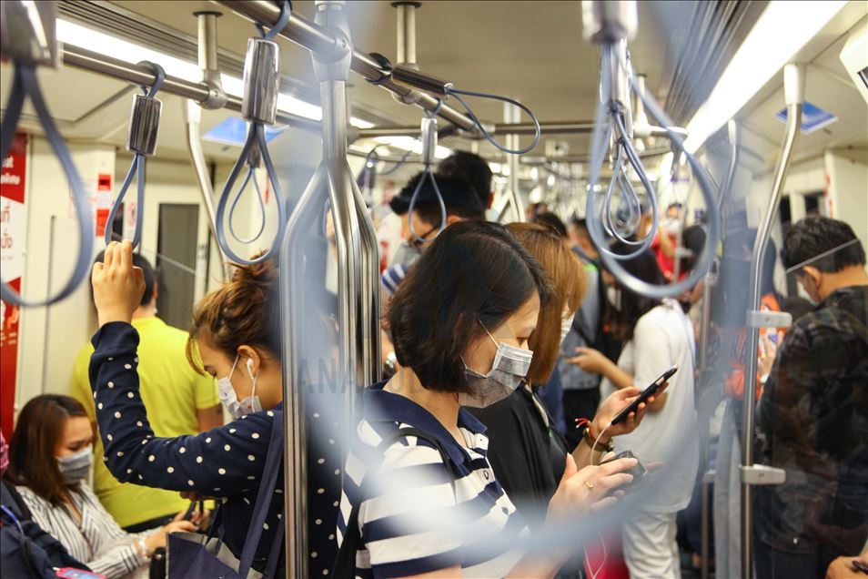 Thai people and tourist with medical mask within precautions against coronavirus in Bangkok metropolitan