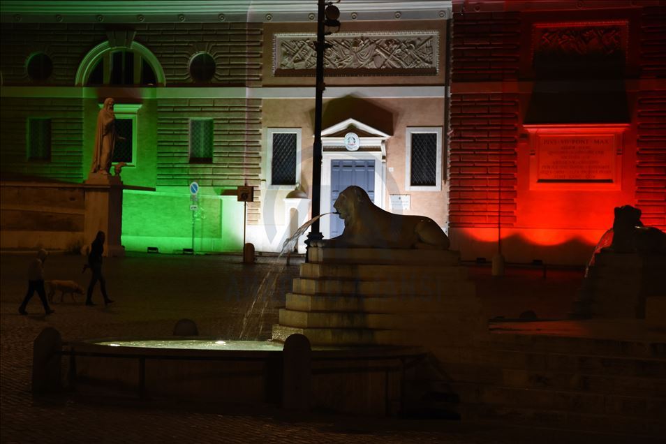 Gedung-gedung nyalakan lampu-lampu dengan warna bendera Italia