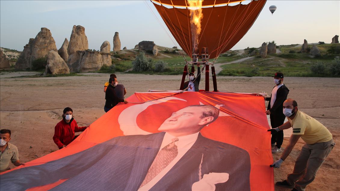 Turkey's domestic and national hot air balloon flies with Ataturk's poster in Nevsehir