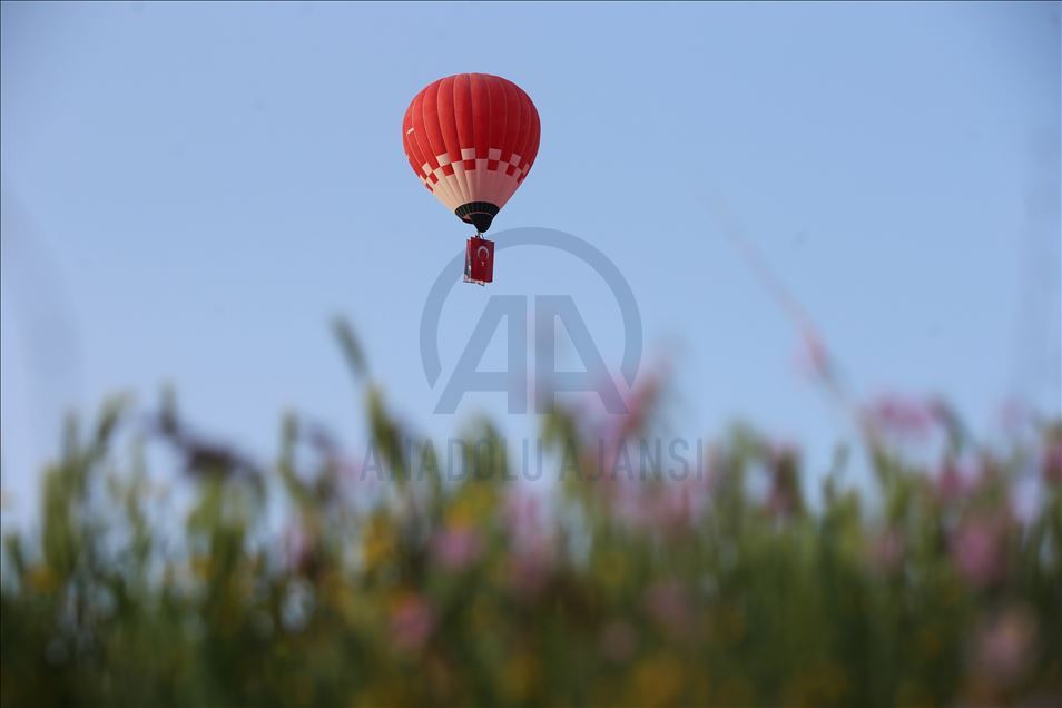 Turkey's domestic and national hot air balloon flies with Ataturk's poster in Nevsehir