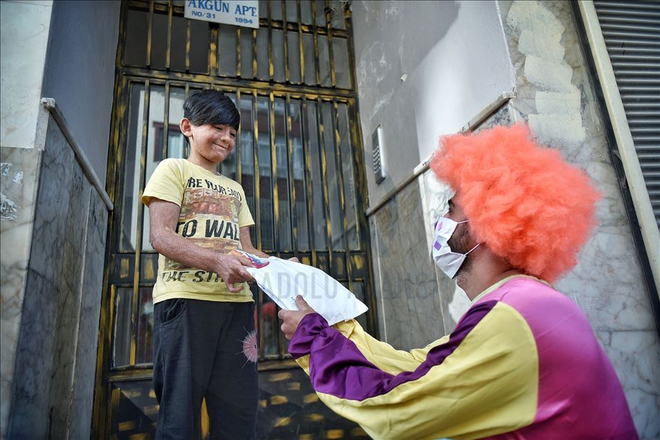 Volunteer clowns distribute Eid al-Fitr presents