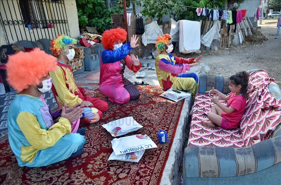 Volunteer clowns distribute Eid al-Fitr presents
