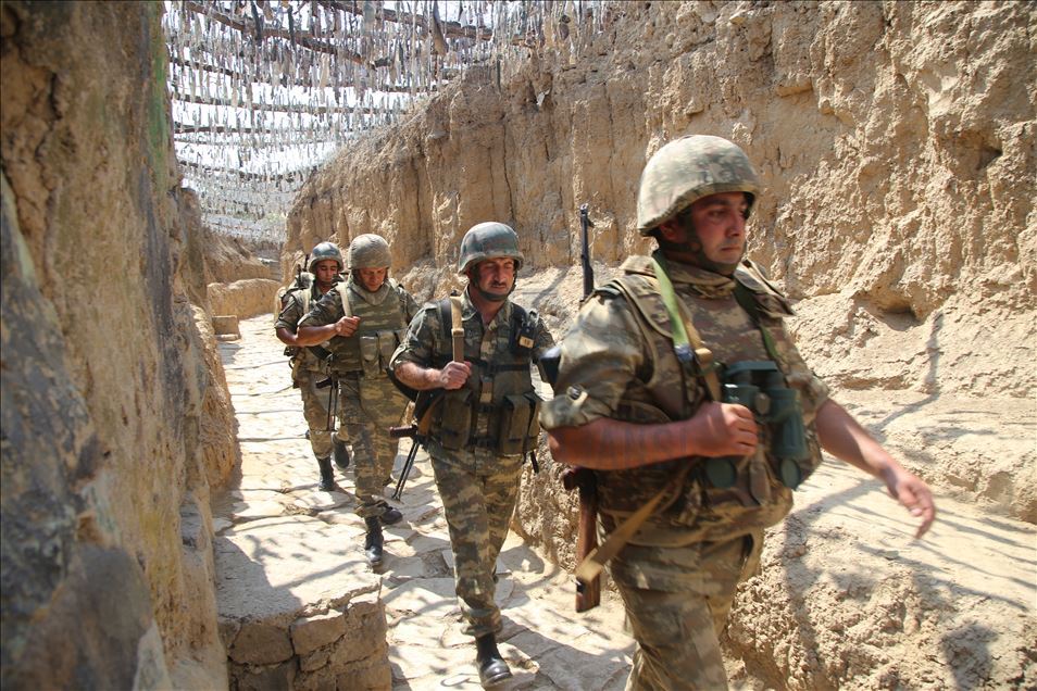 Azerbaijani soldiers patrol to respond to possible attacks in Azerbaijan's Tovuz