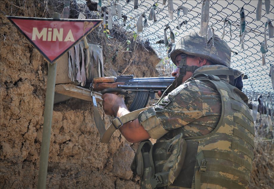 Azerbaijani soldiers patrol to respond to possible attacks in Azerbaijan's Tovuz