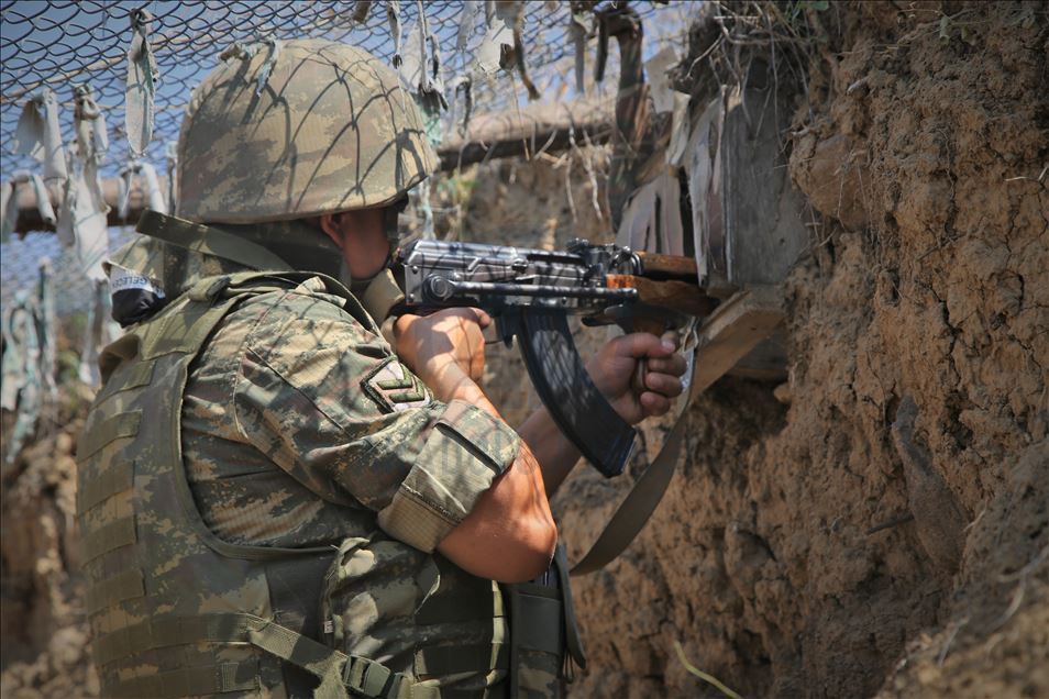 Azerbaijani soldiers patrol to respond to possible attacks in Azerbaijan's Tovuz