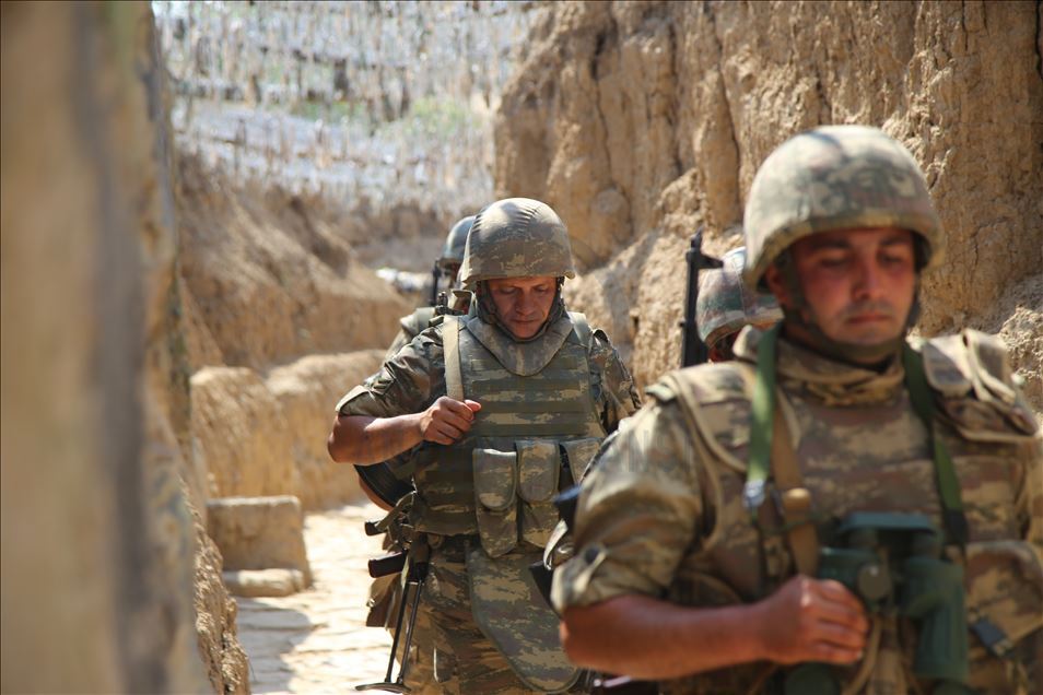 Azerbaijani soldiers patrol to respond to possible attacks in Azerbaijan's Tovuz