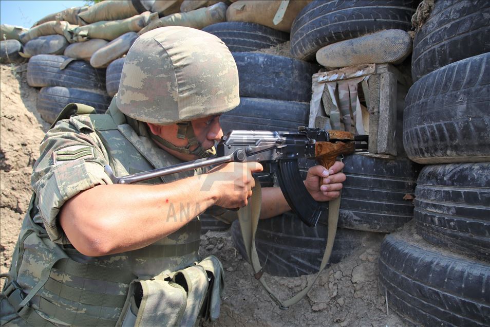 Azerbaijani soldiers patrol to respond to possible attacks in Azerbaijan's Tovuz