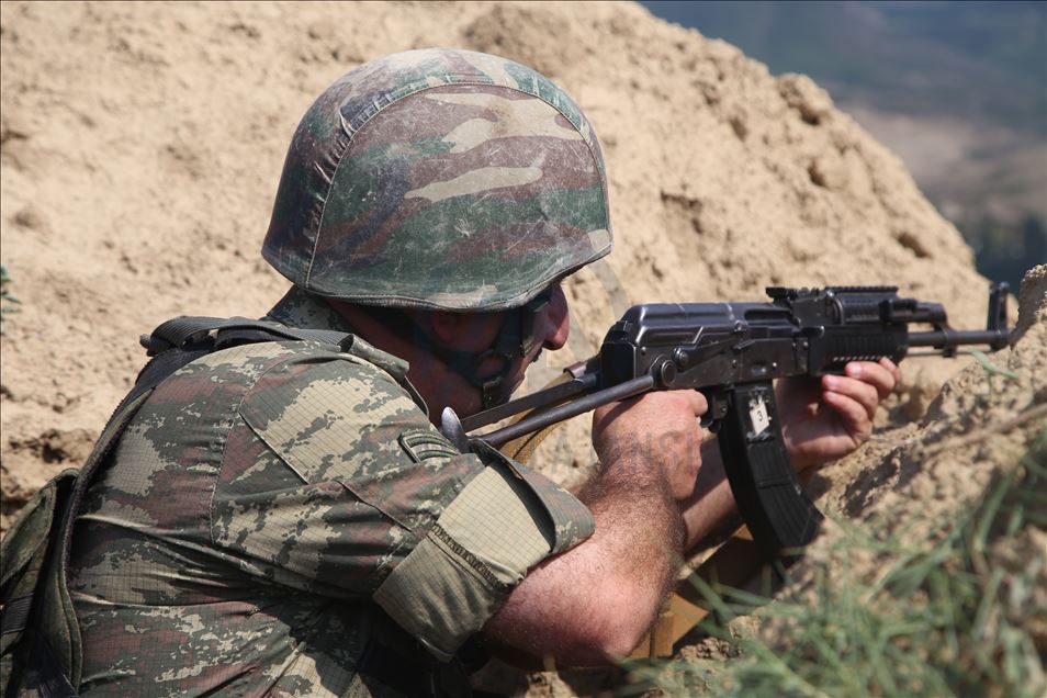 Azerbaijani soldiers patrol to respond to possible attacks in Azerbaijan's Tovuz