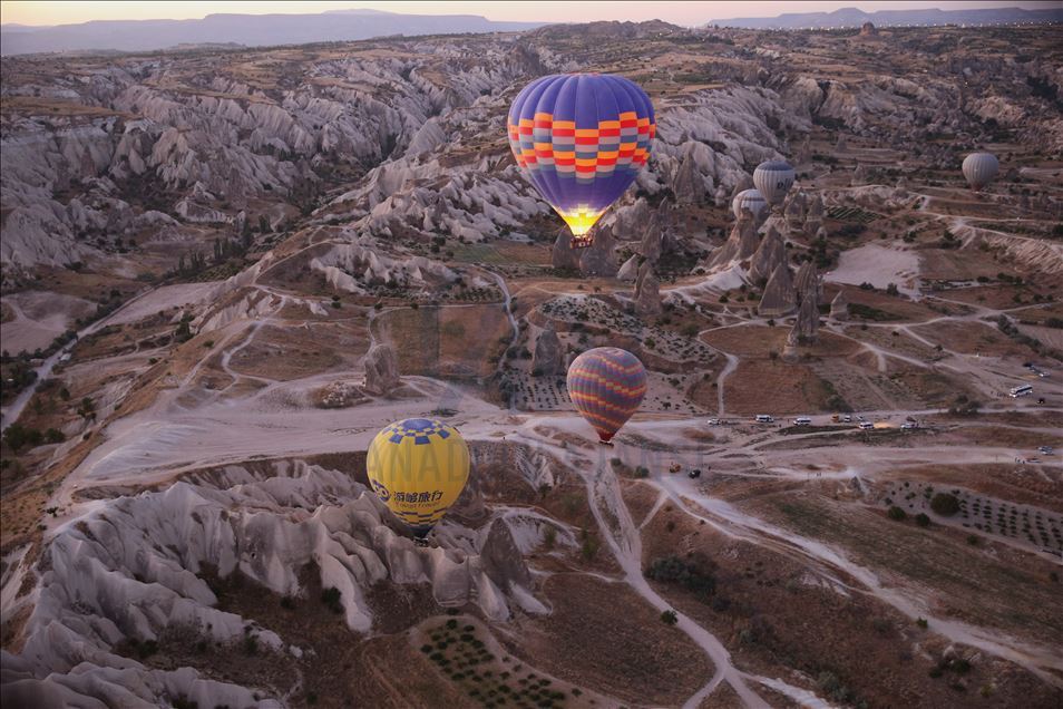 Tourists enjoy beauty of Cappadocia from hot air balloons