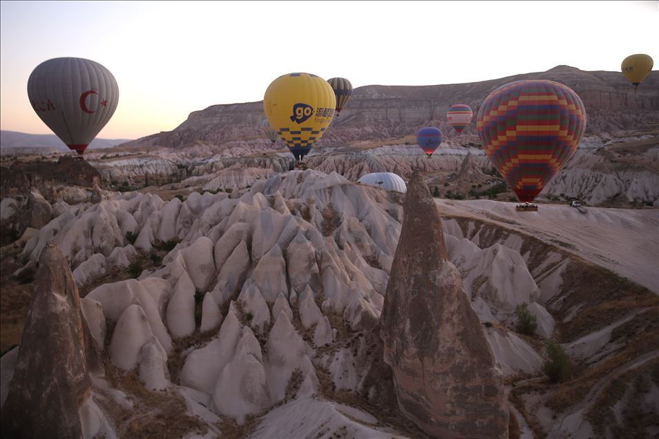 Tourists enjoy beauty of Cappadocia from hot air balloons