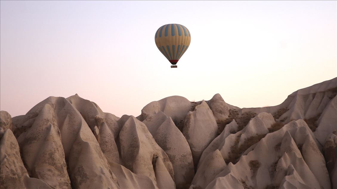 Tourists enjoy beauty of Cappadocia from hot air balloons