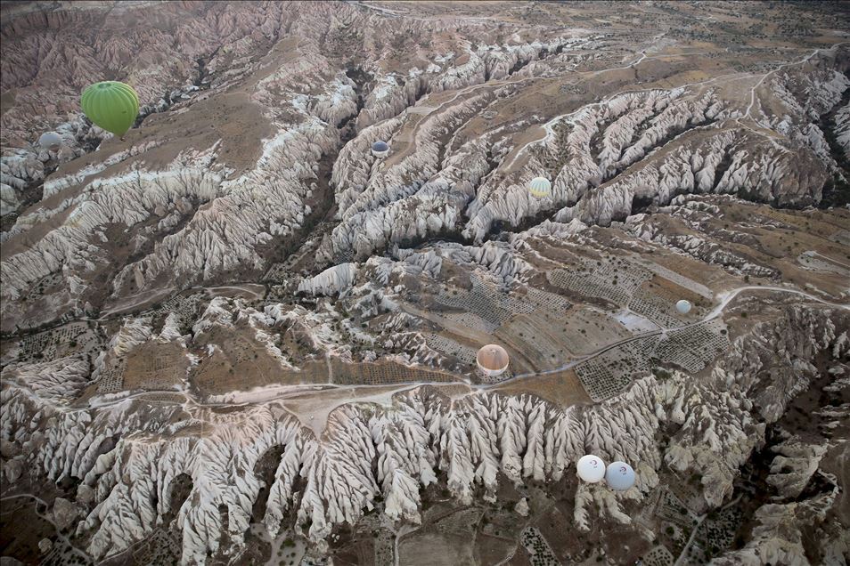 Tourists enjoy beauty of Cappadocia from hot air balloons