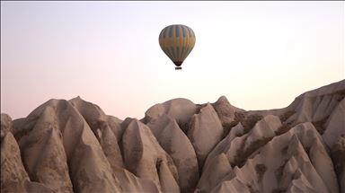 Tourists enjoy beauty of Cappadocia from hot air balloons