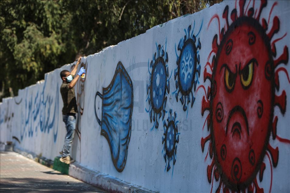 Pintor palestino llama la atención sobre la COVID-19 con grafitis