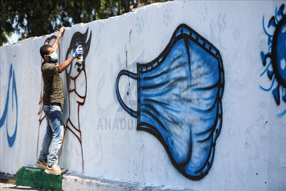 Pintor palestino llama la atención sobre la COVID-19 con grafitis