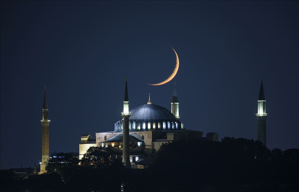 Crescent moon shining in the sky over Istanbul