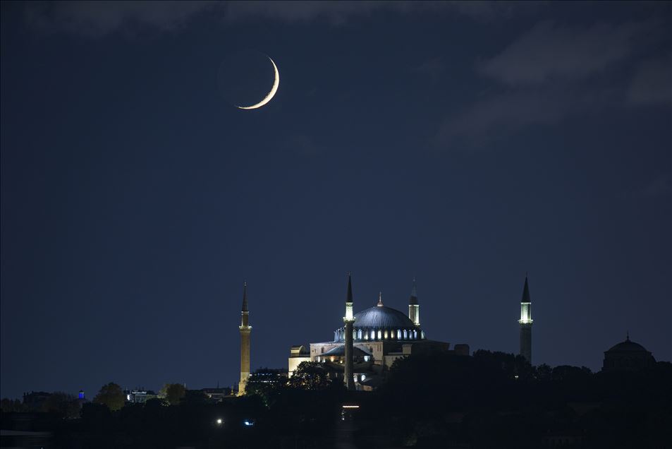 Crescent moon shining in the sky over Istanbul