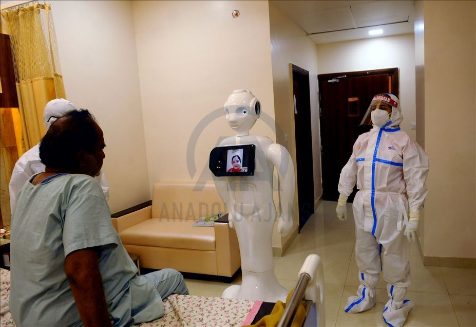 NOIDA, INDIA - SEPTEMBER 27 :A Covid 19 patients taking instructions from a dietician through Indian made Robot used for connecting Covid 19 patients with outside world and giving them a break from isolation in Covid ward of Yatahartha Hospital (at presen