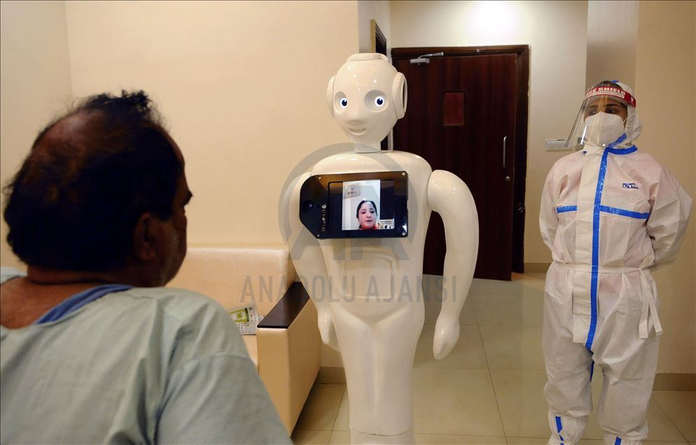 NOIDA, INDIA - SEPTEMBER 27 :A Covid 19 patients taking instructions from a dietician through Indian made Robot used for connecting Covid 19 patients with outside world and giving them a break from isolation in Covid ward of Yatahartha Hospital (at presen